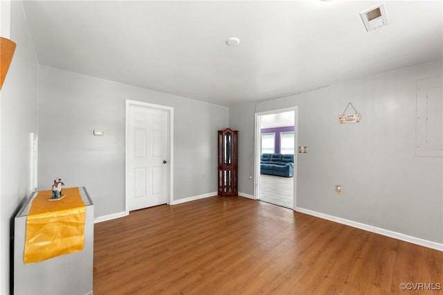 1474 Welsh Tract Rd, Charlotte Courthouse, VA 23923 - empty room with wood finished floors and electric panel
