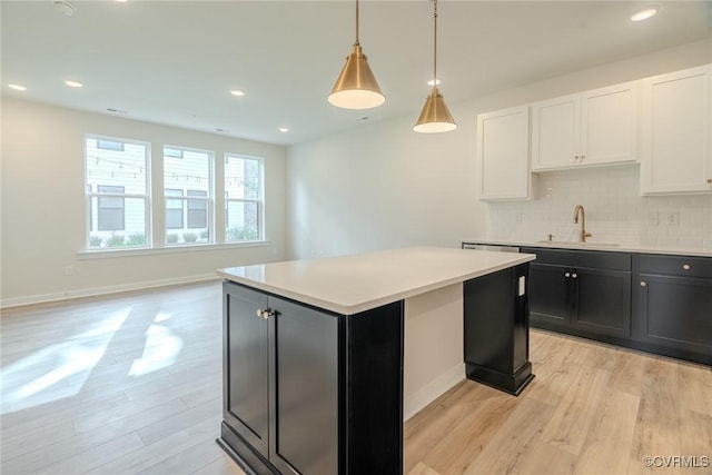 3436 Carlton St Unit 4-5B, Richmond, VA 23230 - kitchen featuring light wood finished floors, baseboards, a sink, tasteful backsplash, and recessed lighting