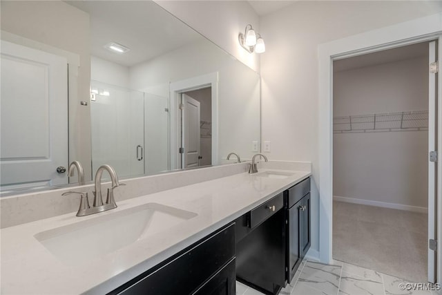 3436 Carlton St Unit 4-5B, Richmond, VA 23230 - bathroom with a shower stall, double vanity, a spacious closet, baseboards, and marble finish flooring