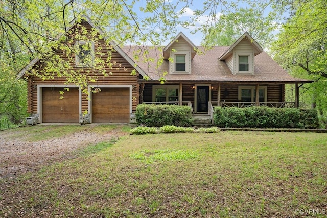 view of front of property featuring a porch, dirt driveway, a front lawn, and log siding