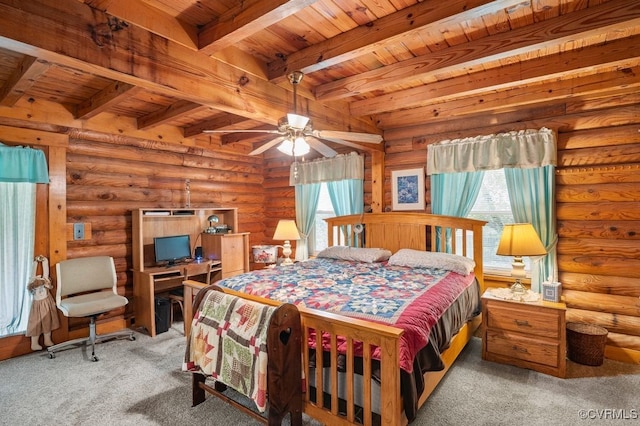 bedroom with carpet, beam ceiling, log walls, and wood ceiling