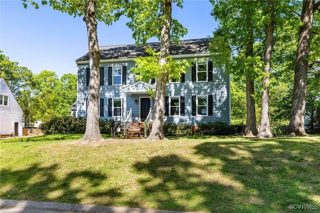 colonial-style house with a front yard