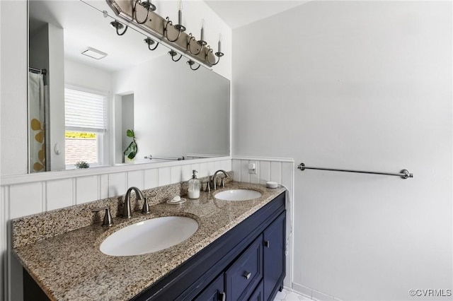 bathroom with double vanity and a sink