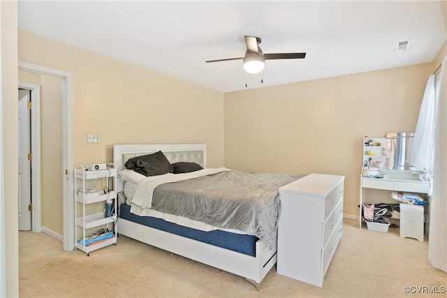 bedroom featuring ceiling fan, light colored carpet, baseboards, and visible vents