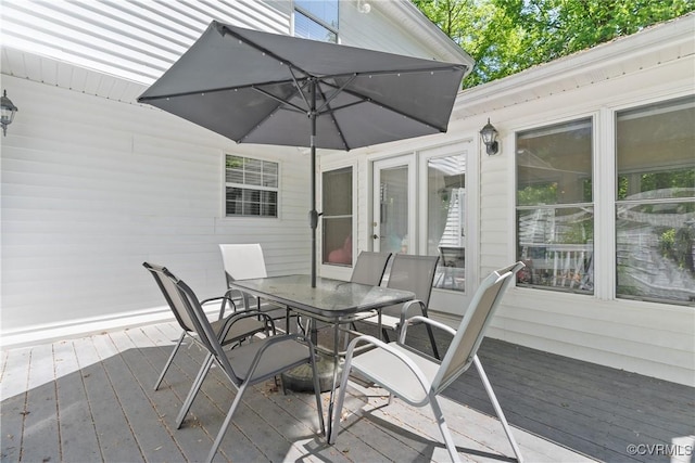 wooden deck with outdoor dining area