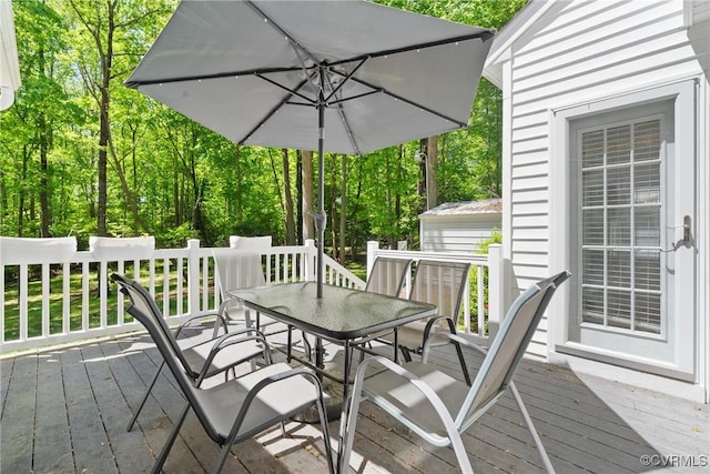 deck featuring outdoor dining space