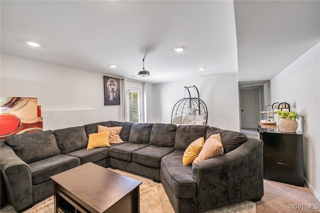 living room featuring recessed lighting and light carpet