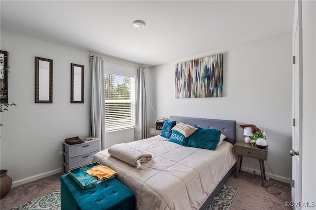 bedroom with baseboards and carpet flooring