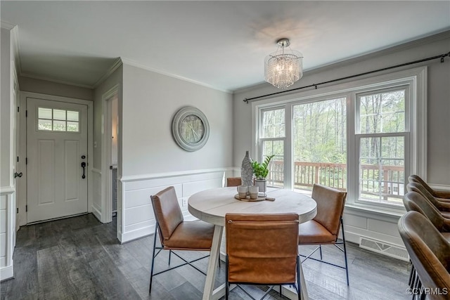 12665 Petersburg St, Chester, VA 23831 - dining room featuring dark wood-type flooring, a wealth of natural light, and a chandelier