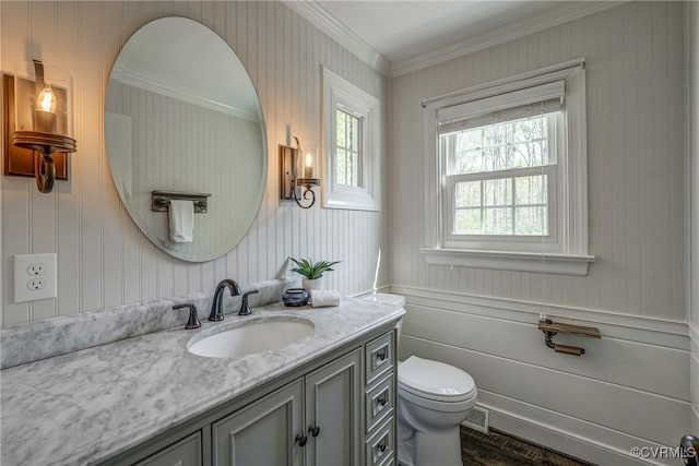 12665 Petersburg St, Chester, VA 23831 - bathroom with a decorative wall, ornamental molding, toilet, and vanity