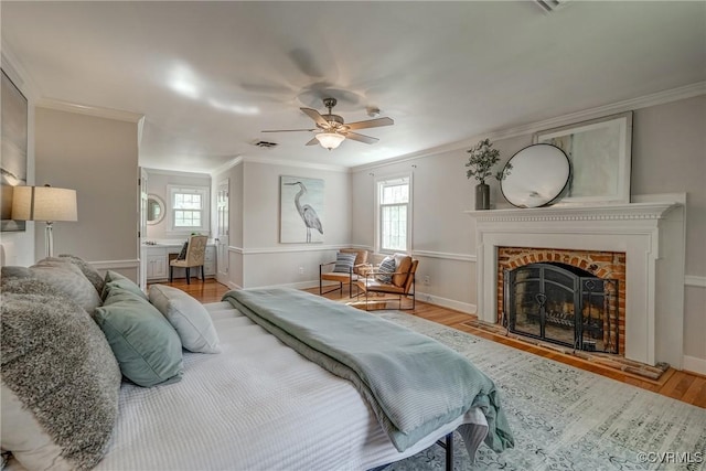 12665 Petersburg St, Chester, VA 23831 - bedroom featuring a fireplace, visible vents, ornamental molding, and wood finished floors