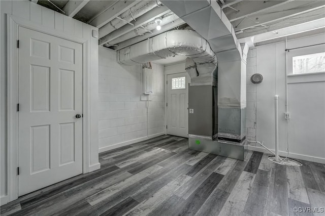 12665 Petersburg St, Chester, VA 23831 - basement with a wealth of natural light, concrete block wall, heating unit, and wood finished floors