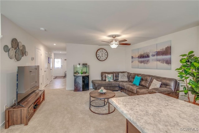 living area featuring recessed lighting, a ceiling fan, and light carpet