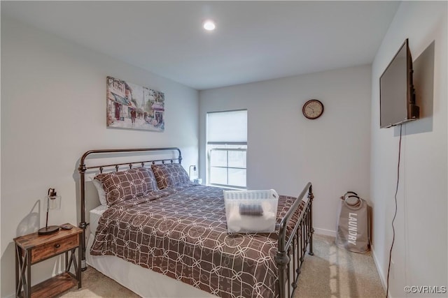 bedroom featuring carpet and baseboards