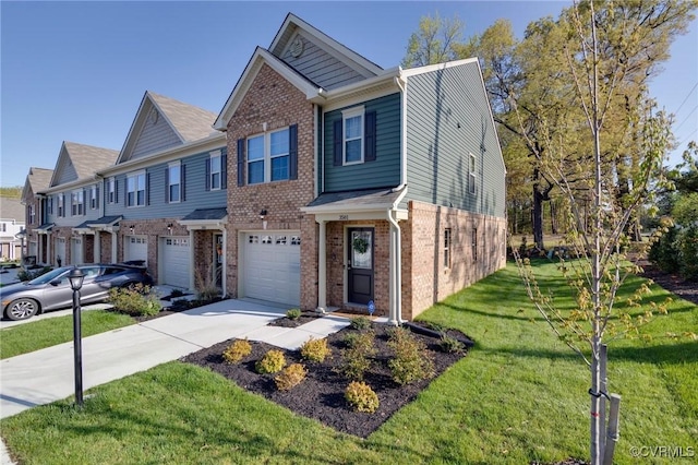 multi unit property featuring a garage, brick siding, a front yard, and concrete driveway