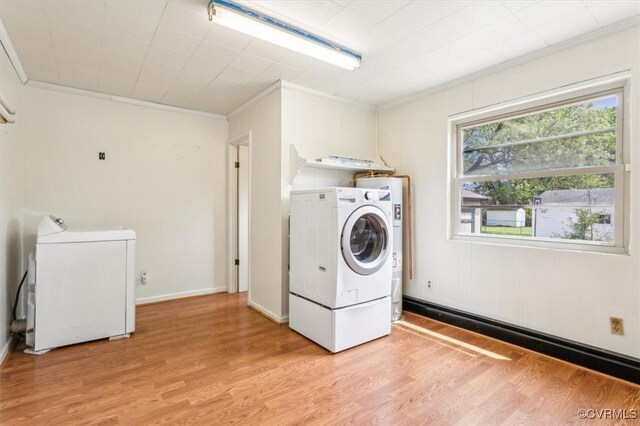 627 Sedgefield Dr, Newport News, VA 23605 - clothes washing area featuring washer and dryer, laundry area, ornamental molding, and light wood-type flooring