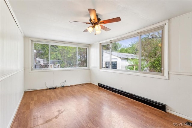 627 Sedgefield Dr, Newport News, VA 23605 - spare room featuring a baseboard radiator, ceiling fan, and wood finished floors