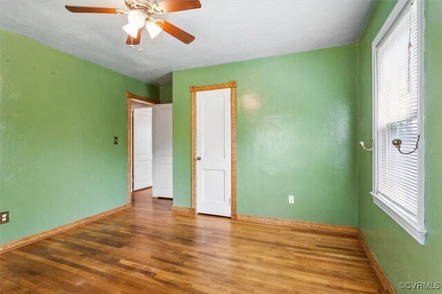 627 Sedgefield Dr, Newport News, VA 23605 - unfurnished bedroom featuring wood finished floors, ceiling fan, and baseboards