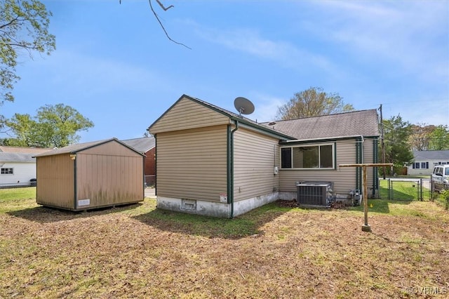 627 Sedgefield Dr, Newport News, VA 23605 - view of side of home featuring an outbuilding, fence, a yard, and central air condition unit