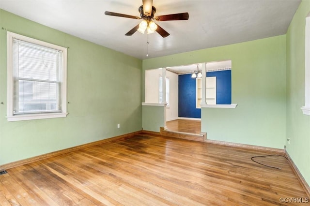 627 Sedgefield Dr, Newport News, VA 23605 - unfurnished room with baseboards, ceiling fan, a wealth of natural light, and wood finished floors