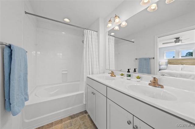 ensuite bathroom with a sink, double vanity, connected bathroom, and shower / tub combo with curtain