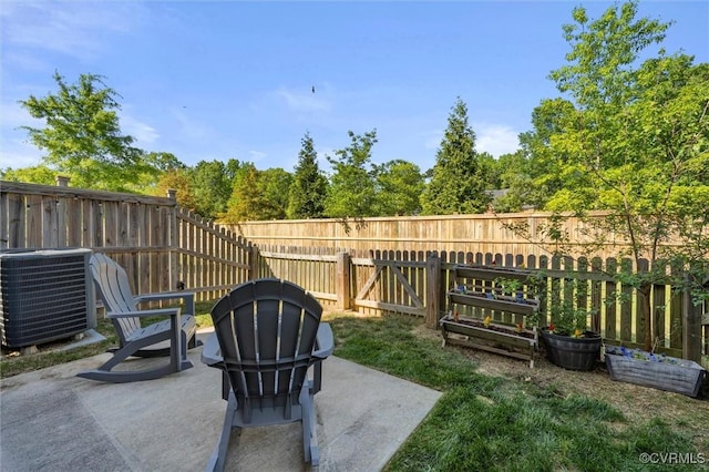 view of patio / terrace with a fenced backyard and central AC unit