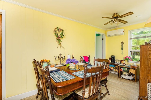dining space with ornamental molding, a wall mounted AC, light wood finished floors, and a ceiling fan