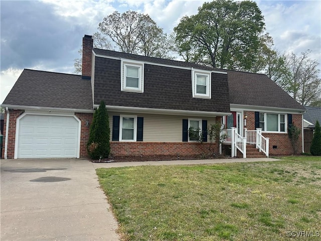 tri-level home featuring a front yard, roof with shingles, brick siding, an attached garage, and driveway