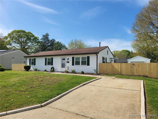 view of front of home with a front lawn and fence