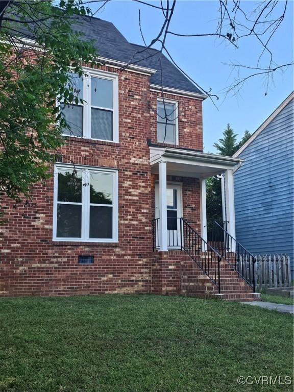 1512 Lakeview Ave, Richmond, VA 23220 - traditional-style house with a front lawn and brick siding