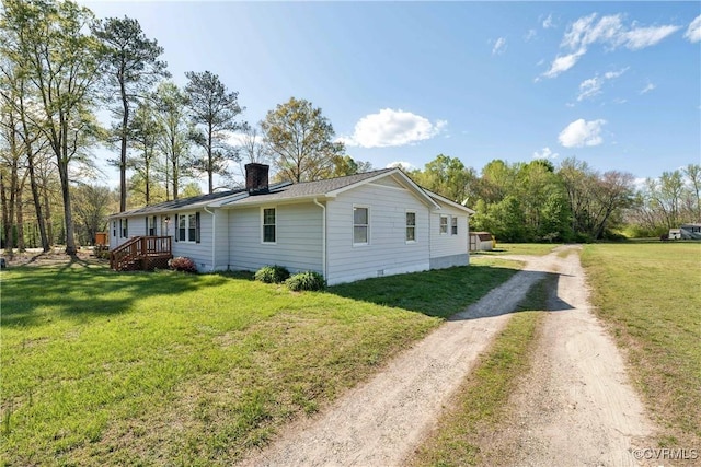 932 Eastern View Rd, King & Queen, VA 23148 - view of property exterior with dirt driveway, a chimney, and a yard