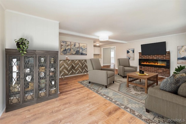 932 Eastern View Rd, King & Queen, VA 23148 - living room with a brick fireplace, wood finished floors, and ornamental molding
