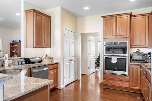 9952 Sunny Oak Dr, Mechanicsville, VA 23116 - kitchen featuring a sink, appliances with stainless steel finishes, light stone counters, dark wood-style floors, and recessed lighting