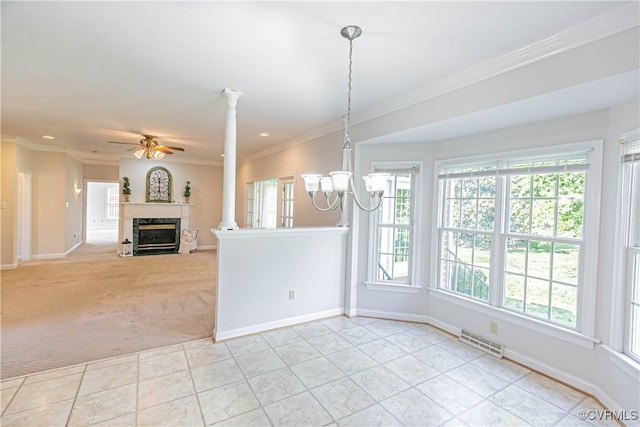 interior space with visible vents, ornamental molding, ceiling fan with notable chandelier, and a healthy amount of sunlight