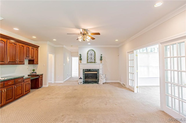 unfurnished living room with ceiling fan, recessed lighting, and light colored carpet