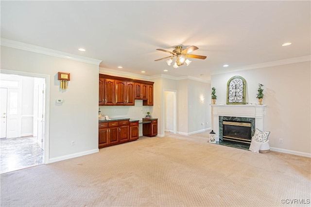 unfurnished living room featuring recessed lighting, ceiling fan, light colored carpet, and baseboards