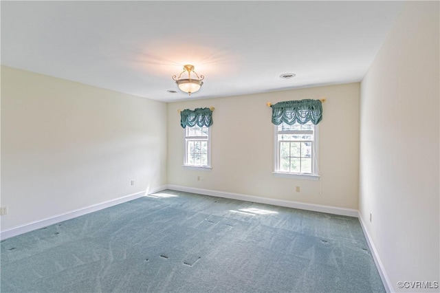 unfurnished room featuring baseboards and carpet flooring