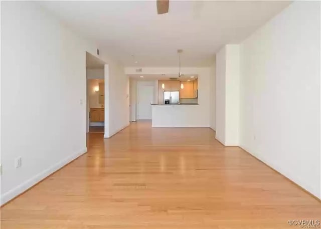 unfurnished living room featuring light wood-style floors