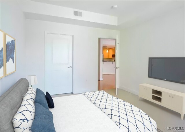 bedroom featuring carpet flooring and visible vents