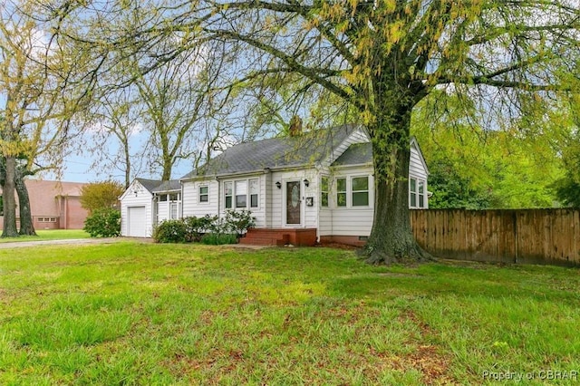 view of front of house with crawl space, fence, a front lawn, an attached garage, and driveway