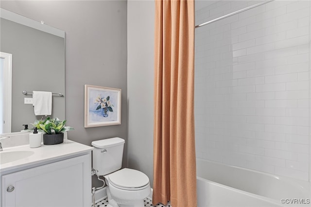 bathroom with vanity, shower / bath combo with shower curtain, and toilet