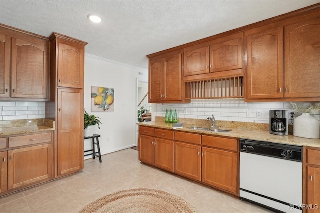 12211 Mill Race Run, Amelia, VA 23002 - kitchen with light stone counters, white dishwasher, a sink, and backsplash