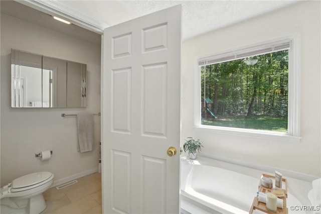 12211 Mill Race Run, Amelia, VA 23002 - full bathroom featuring tile patterned flooring, toilet, baseboards, visible vents, and a garden tub