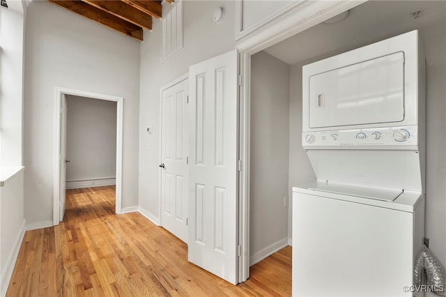 1716 Summit Ave Unit 30, Richmond, VA 23230 - laundry area featuring baseboards, stacked washer and clothes dryer, light wood-style flooring, and laundry area
