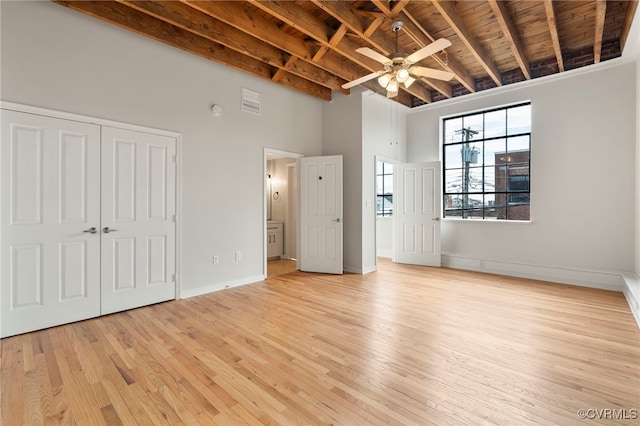 1716 Summit Ave Unit 30, Richmond, VA 23230 - unfurnished bedroom with light wood-style flooring, baseboards, wooden ceiling, a towering ceiling, and beamed ceiling