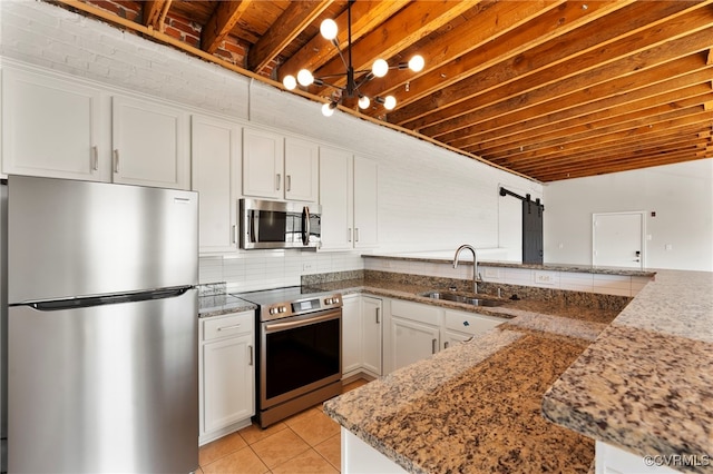 1716 Summit Ave Unit 30, Richmond, VA 23230 - kitchen with a sink, appliances with stainless steel finishes, light tile patterned floors, and white cabinetry