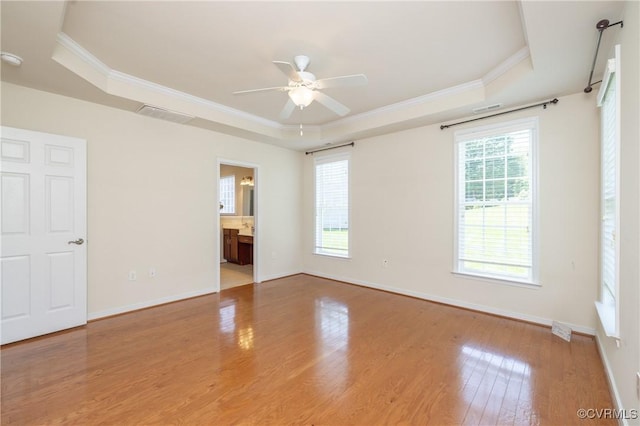 7516 Shadow Lands Ct, Mechanicsville, VA 23111 - unfurnished bedroom with a raised ceiling, multiple windows, ornamental molding, wood finished floors, and baseboards