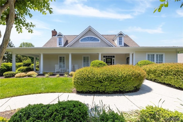 7516 Shadow Lands Ct, Mechanicsville, VA 23111 - view of front of house featuring a chimney, a front lawn, and covered porch
