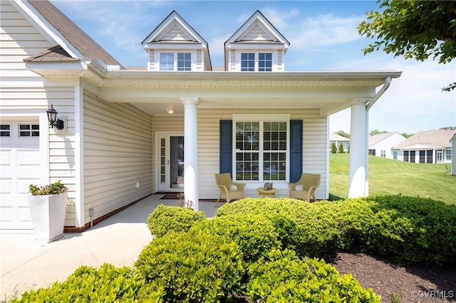 7516 Shadow Lands Ct, Mechanicsville, VA 23111 - property entrance featuring covered porch, an attached garage, and a lawn