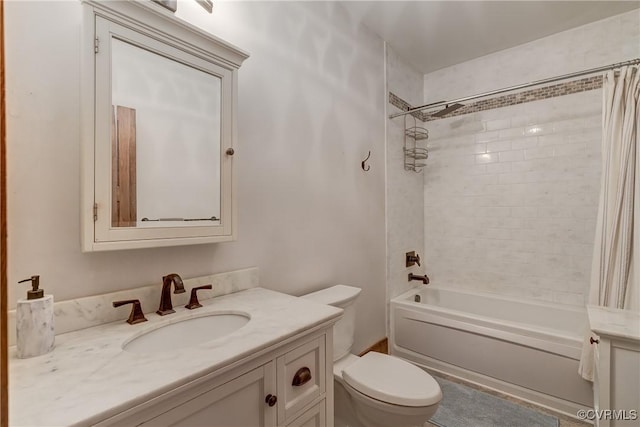 full bath featuring shower / bath combo, vanity, and toilet